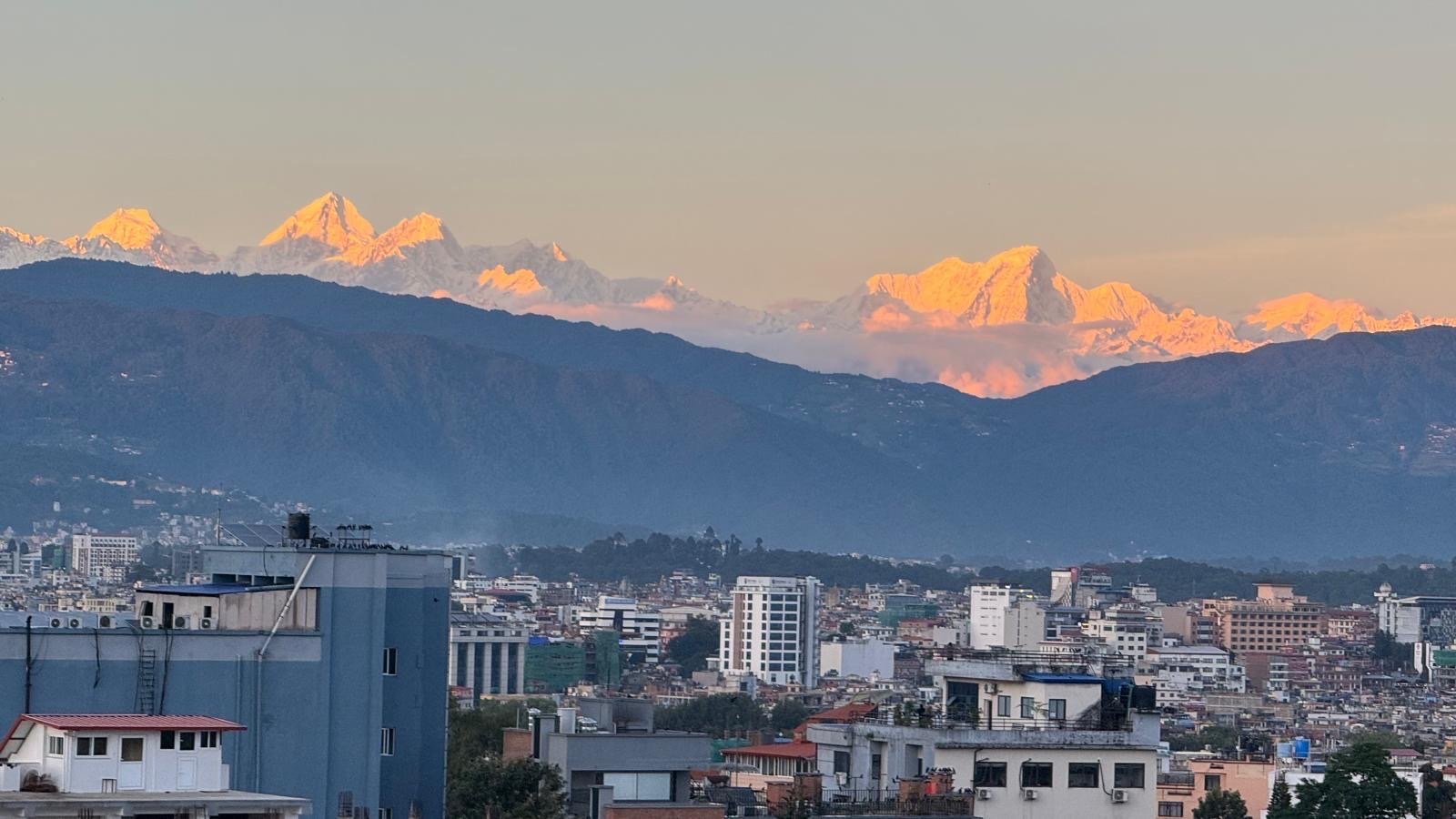 Sunset light on the Himalayas above the Kathmandu Valley, seen from Prasiddhi Towers